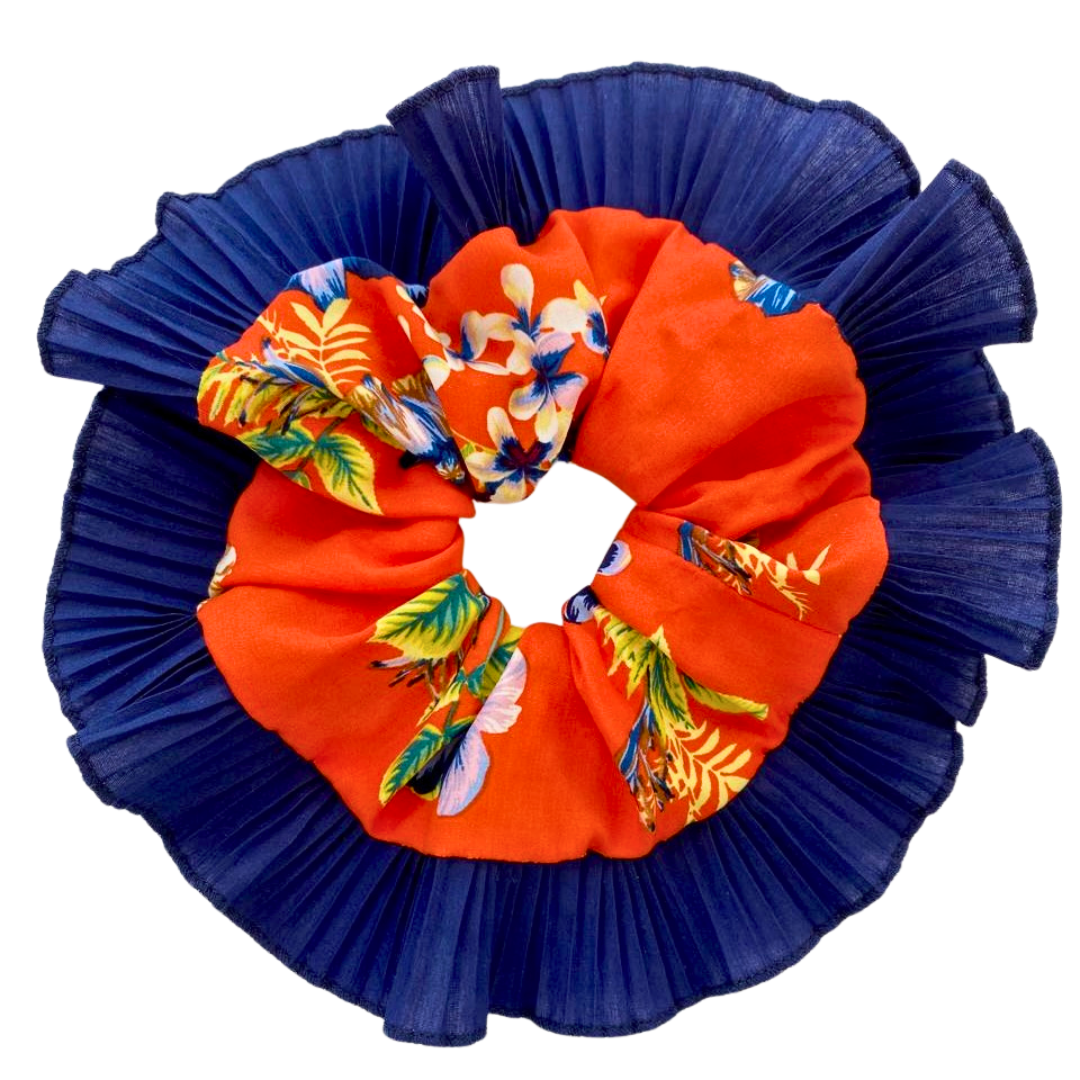 Floral-patterned hair scrunchie with blue and orange colors on a white background