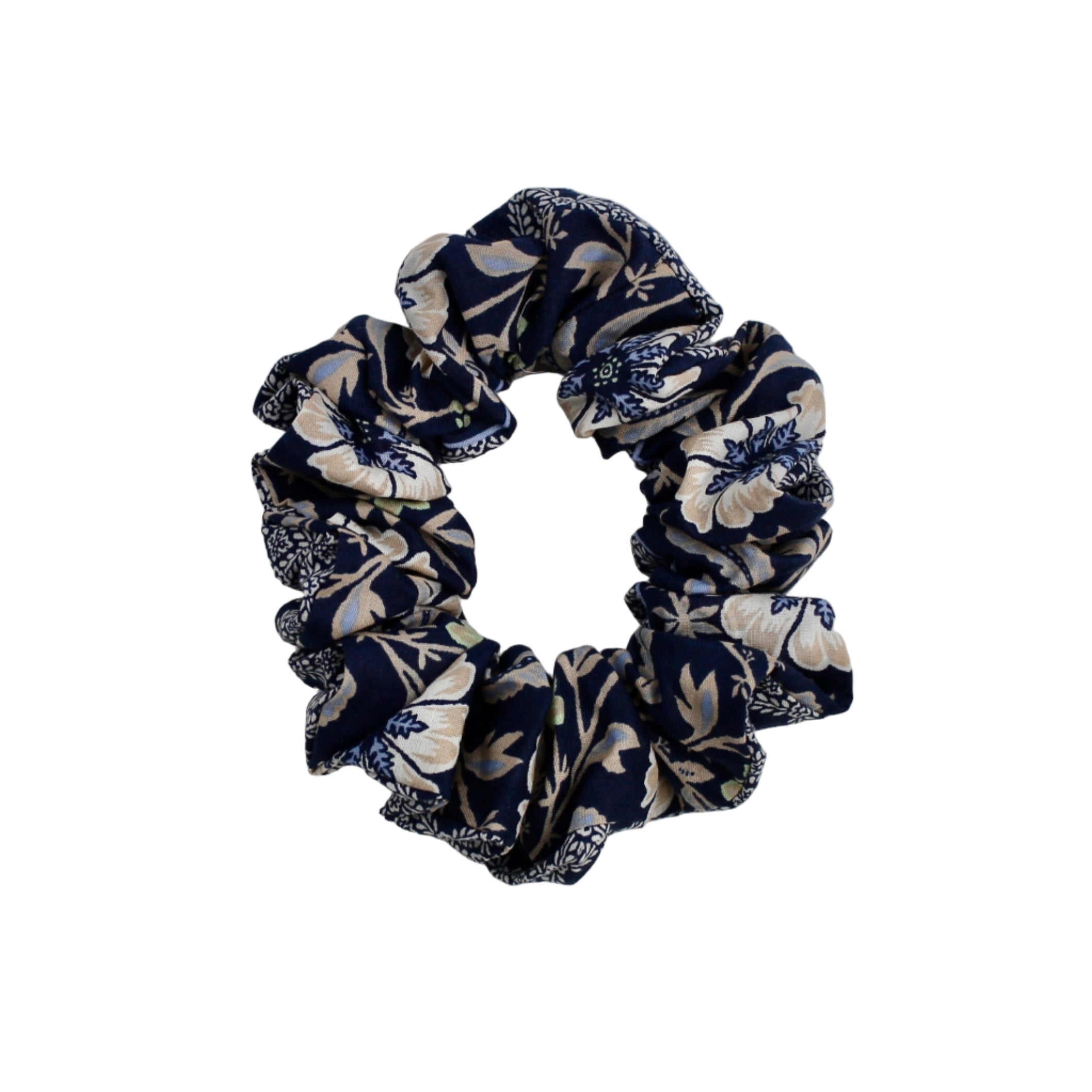 Navy blue and white floral scrunchie on a white background