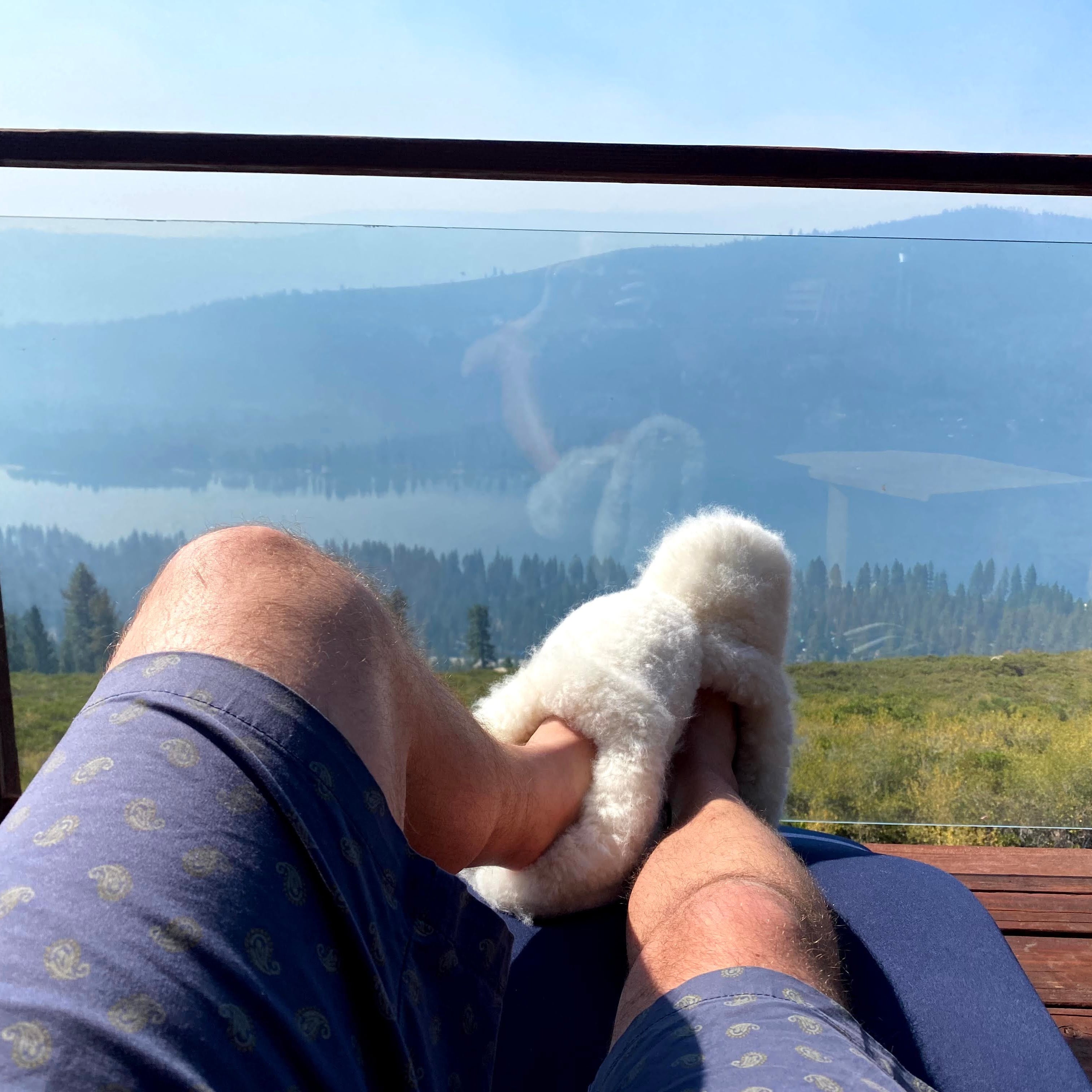 Men using white slipper looking the Tahoe lake