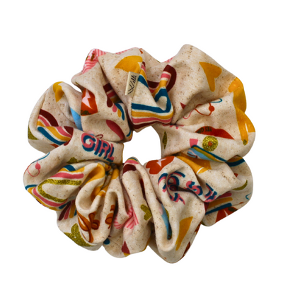 Colorful scrunchie with cartoon designs on a white background