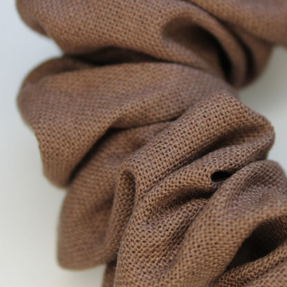 Brown scrunchie on a white background