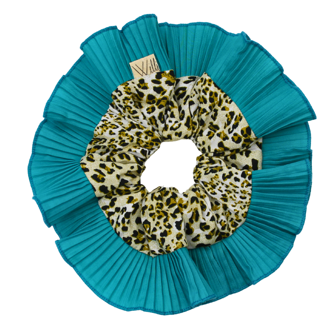 Teal scrunchie with leopard print center on a white background