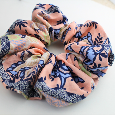 Set of floral patterned scrunchies on a white background