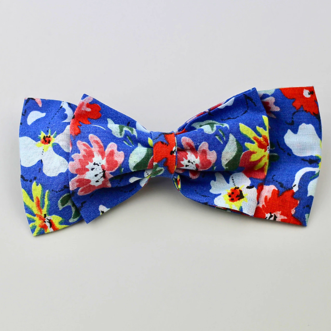 Colorful floral bow tie on a white background
