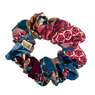 Set of colorful patterned scrunchies on a white background