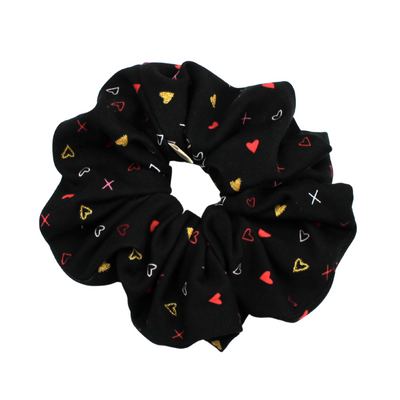 Black scrunchie with colorful heart pattern on a white background