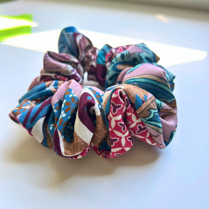 Colorful scrunchies on a white surface