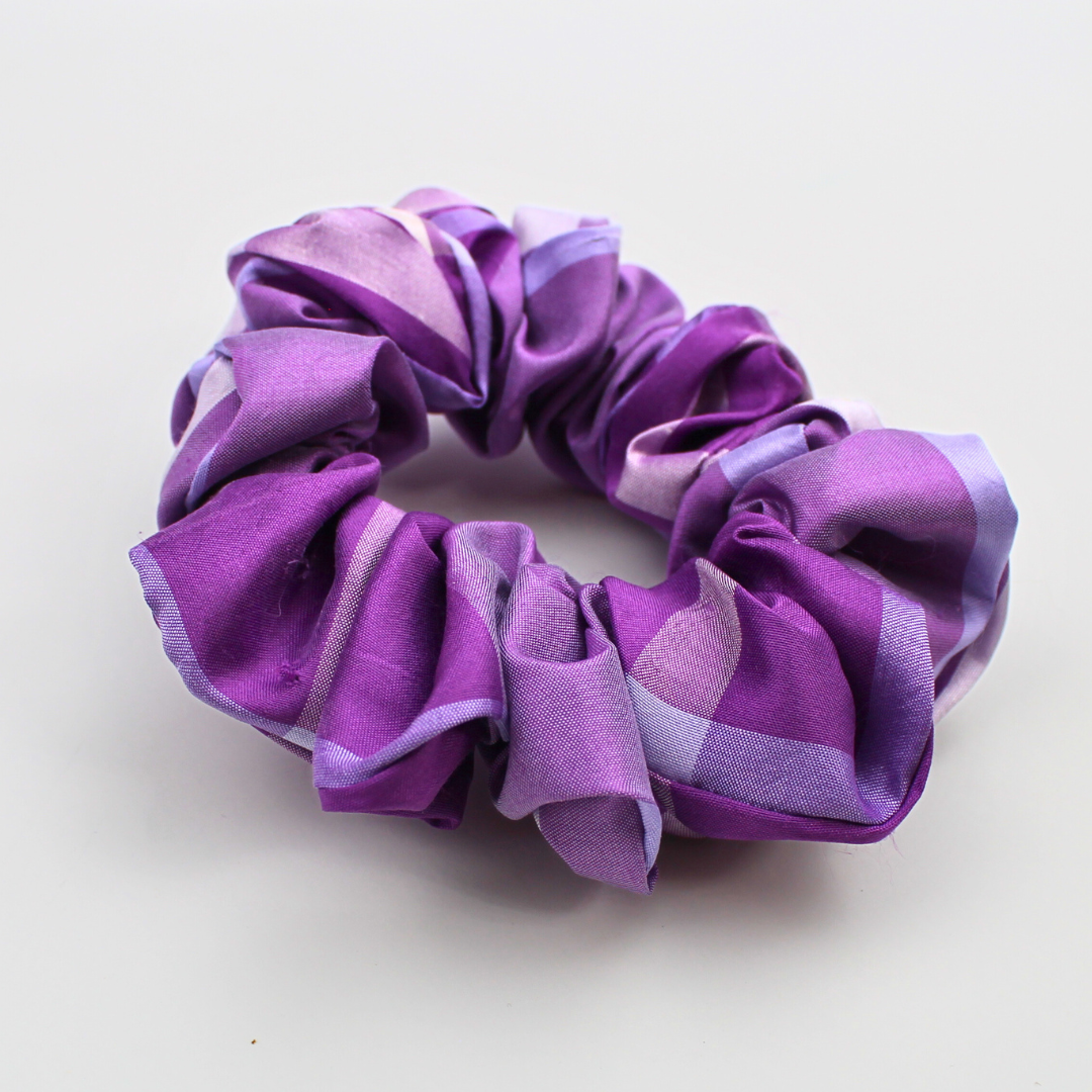 Purple and pink scrunchie on a white background