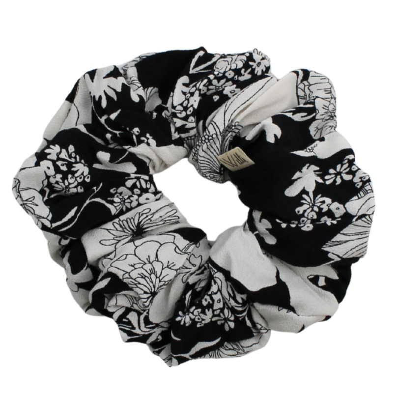 Black and white floral scrunchie on a white background