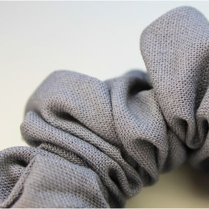 Close up Gray scrunchie on a light gray background