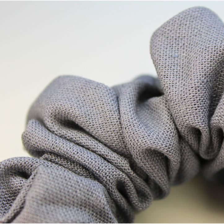 Close up Gray scrunchie on a light gray background