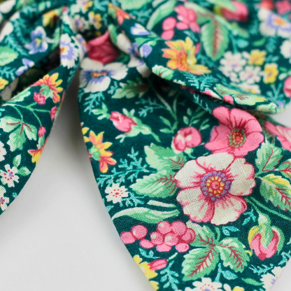 Floral fabric with pink, green, and blue flowers on a white background