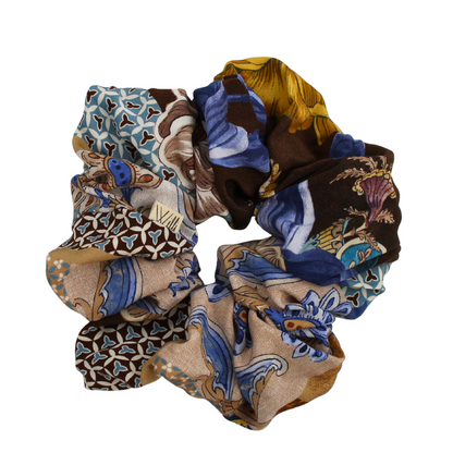 Set of three patterned scrunchies on a white background
