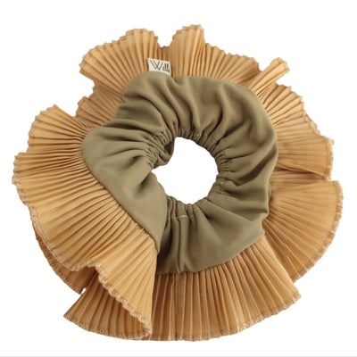 A beige oversized scrunchie with ruffles, displayed on a plain background.