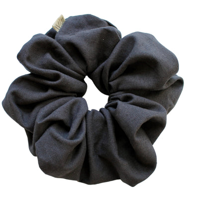Dark grey scrunchie on a white background