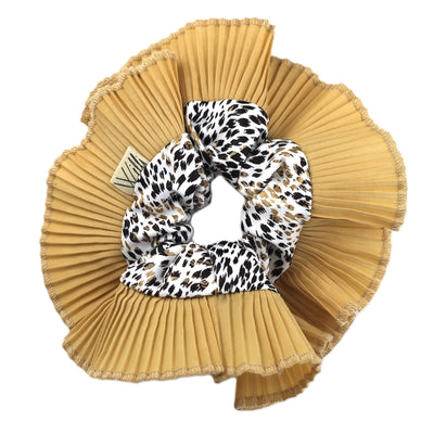 A ruffle scrunchie with a cheetah print design on a pleated golden background.