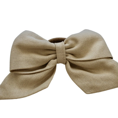 beige hair tie ribbon on white background