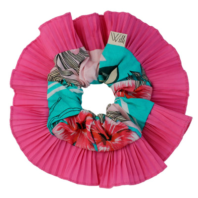 Set of colorful scrunchies with a pink pleated holder on a white background