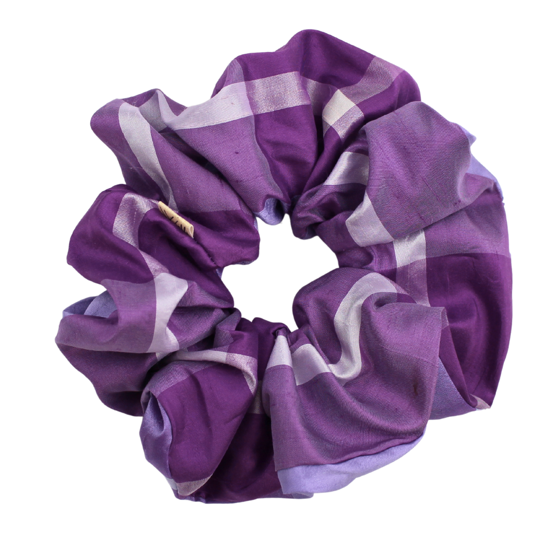 Purple and white striped scrunchie on a white background