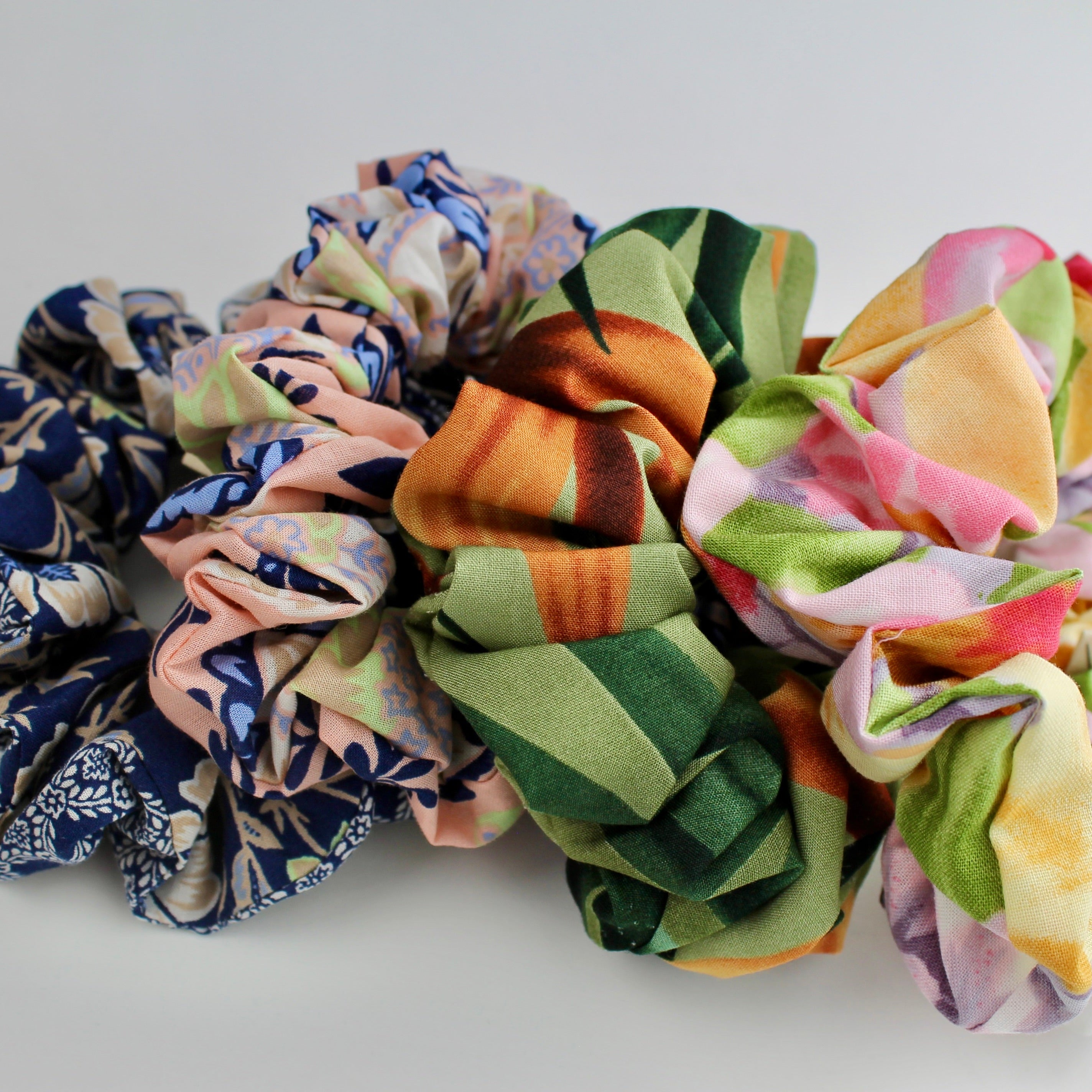 Set of colorful scrunchies on a light background