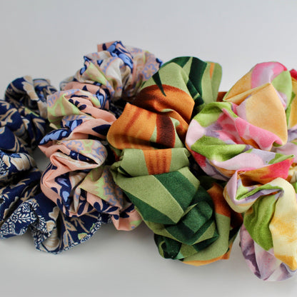 Set of colorful scrunchies on a light background