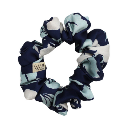 Navy and white patterned scrunchie on a white background